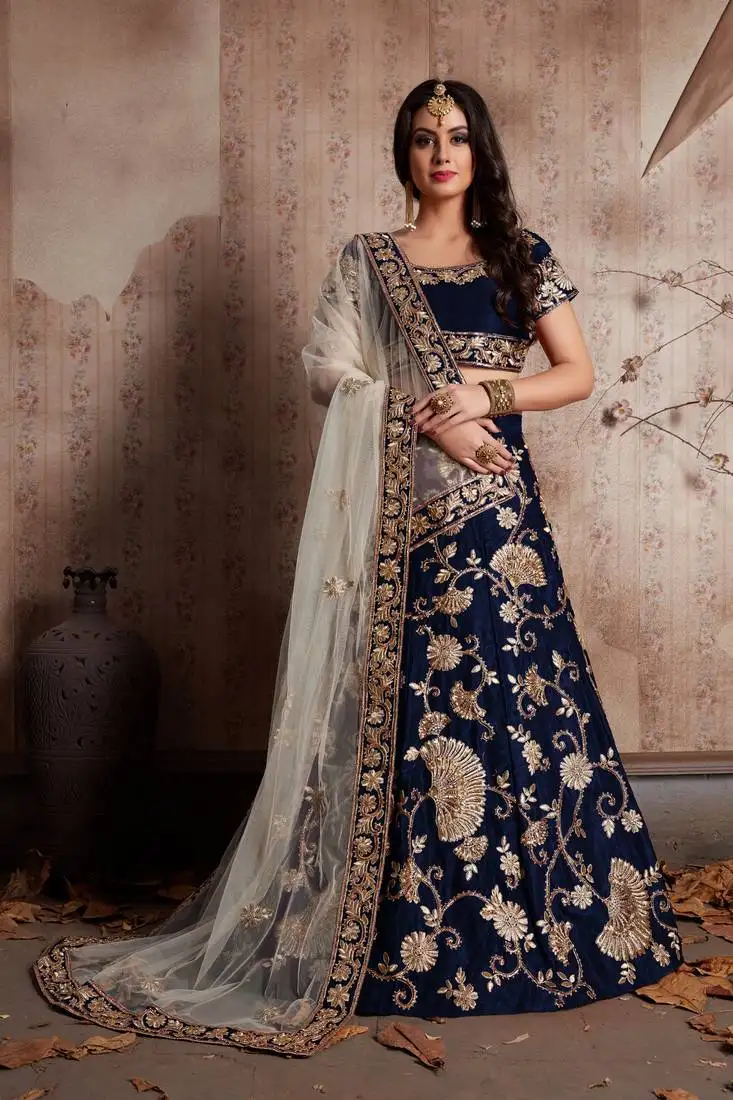Navy blue velvet stone work embroidered traditional lehenga choli with net dupatta