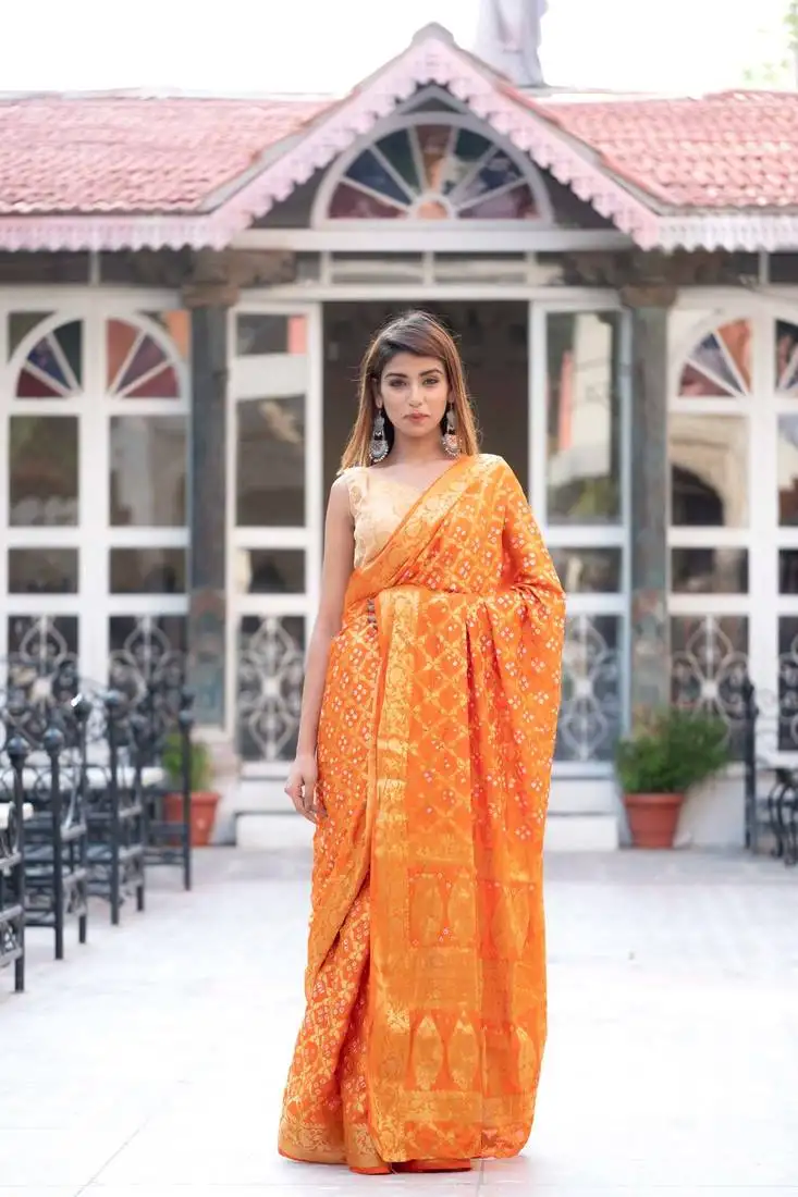 Kesariya rang art silk saree with golden blouse