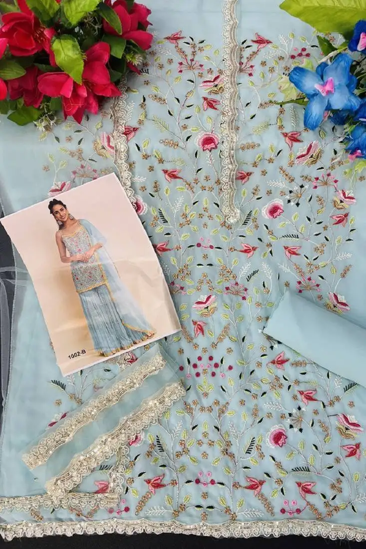 Aqua blue embroidered georgette punjabi suit with net dupatta semi stitched