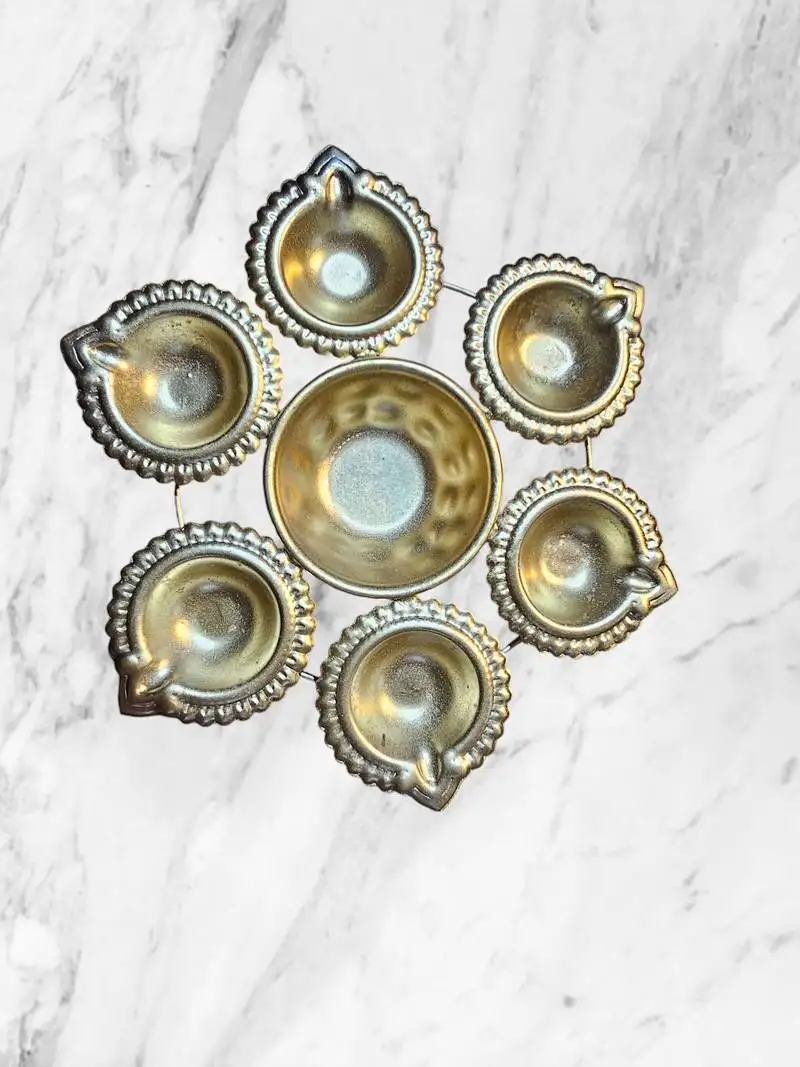 Golden metal diya urli for diwali pooja:: pooja