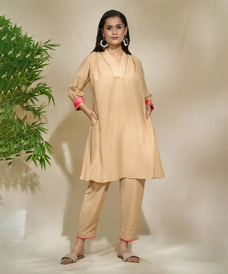 Beige red pink tunic set - tagai work highlighted zari sequence work on pants sleeves & back