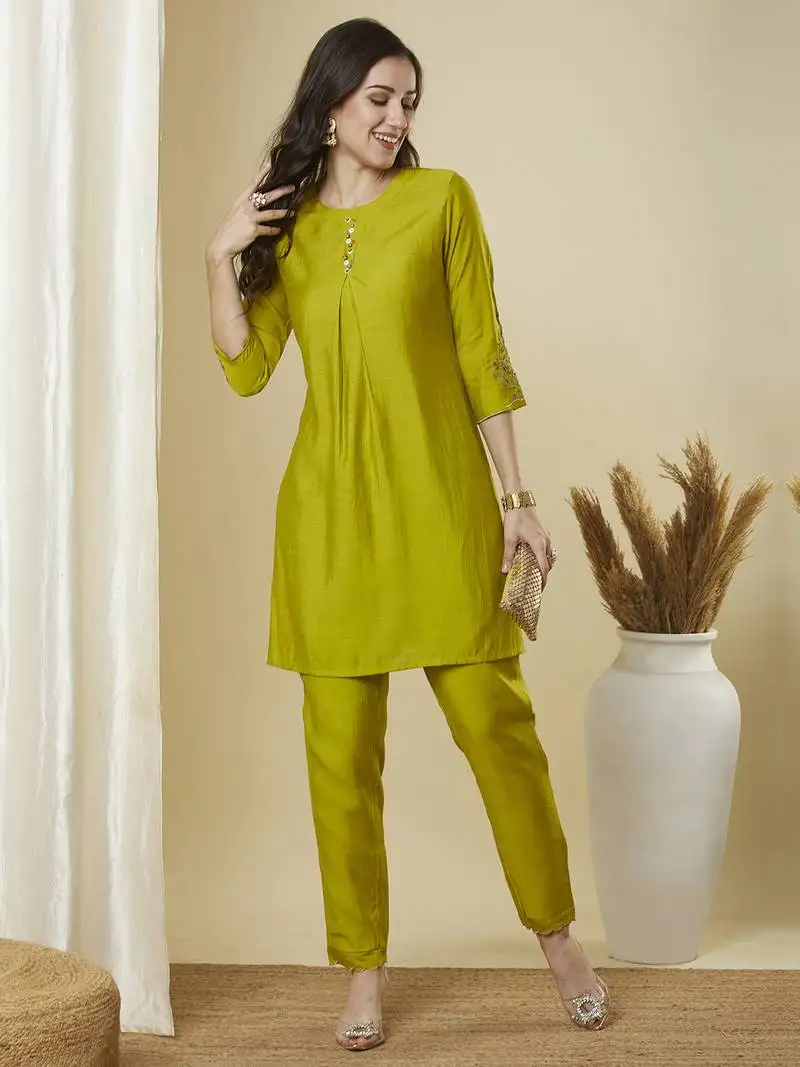 A centre box pleated co-ord set with sleeves embroidery and handwork.