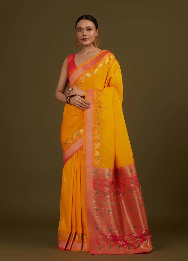 Yellow banarasi silk blend saree in classic paisley zari pallu & unstitched blouse