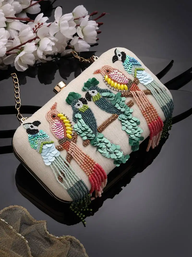 Adorn off white & multi quirky embellished corduroy clutch