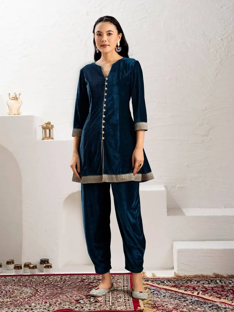 Aask women solid velvet lace work navy blue color kurta & pant set stitched