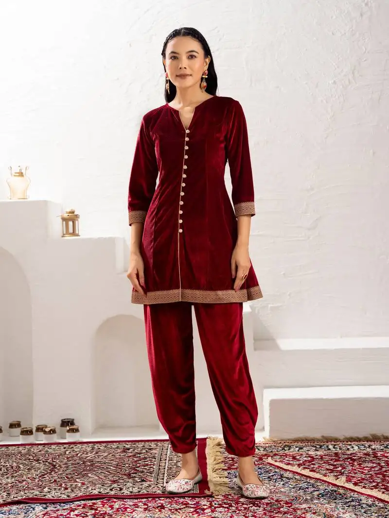 Aask women solid velvet lace work maroon color kurta & pant set stitched