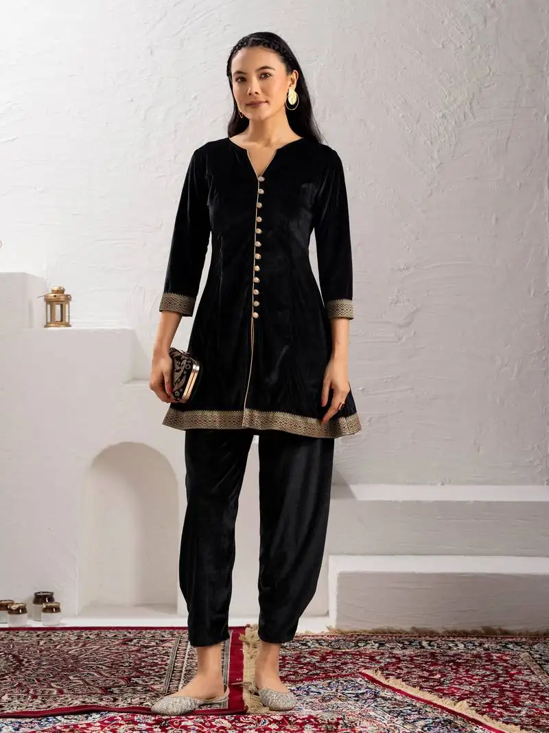 Aask women solid velvet lace work black color kurta & pant set stitched