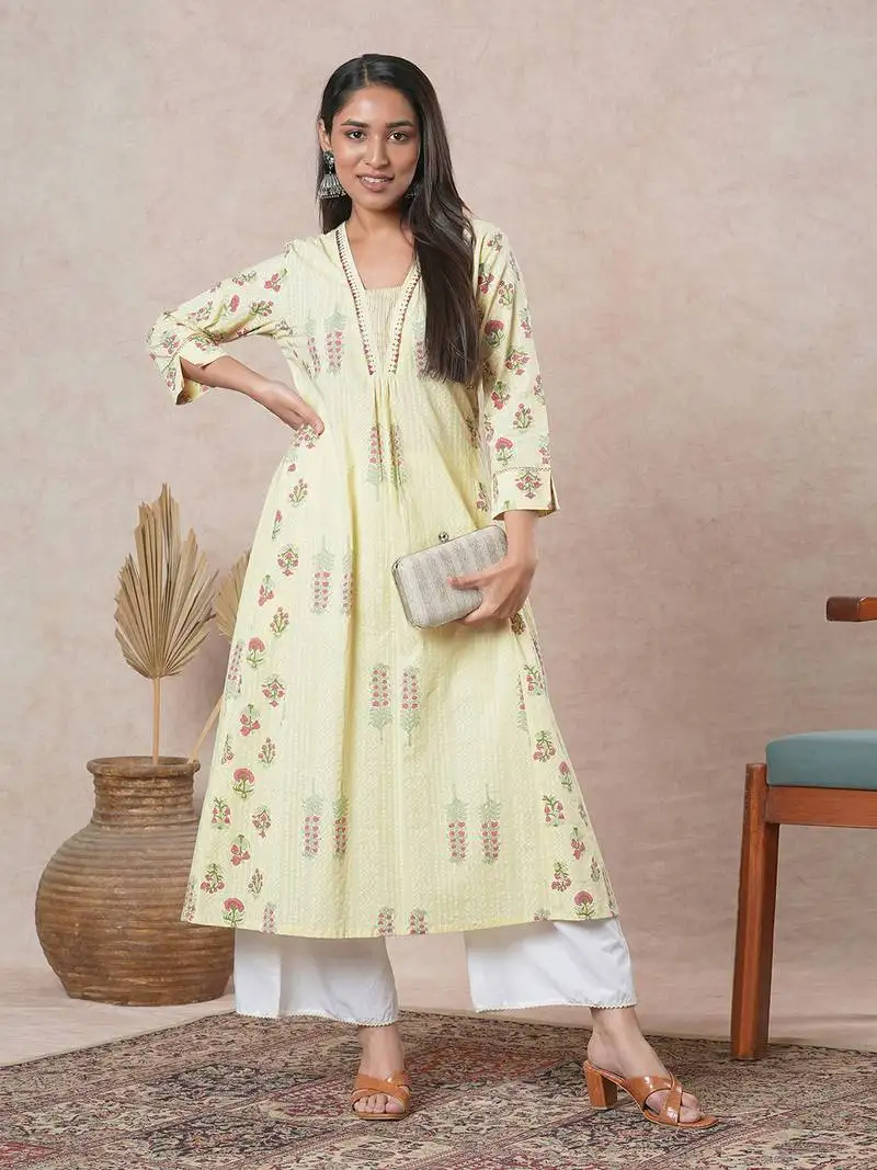 A-line cotton kurta with embroidered neckline and blend of two different prints.