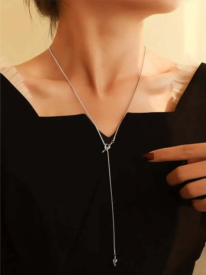 Silver plated tassel knot necklace