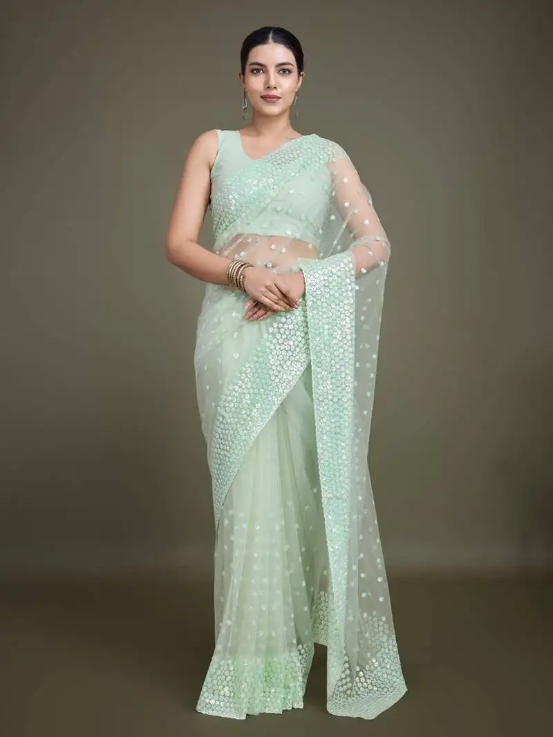 Women's light green soft net saree with sequin embellished border and pallu