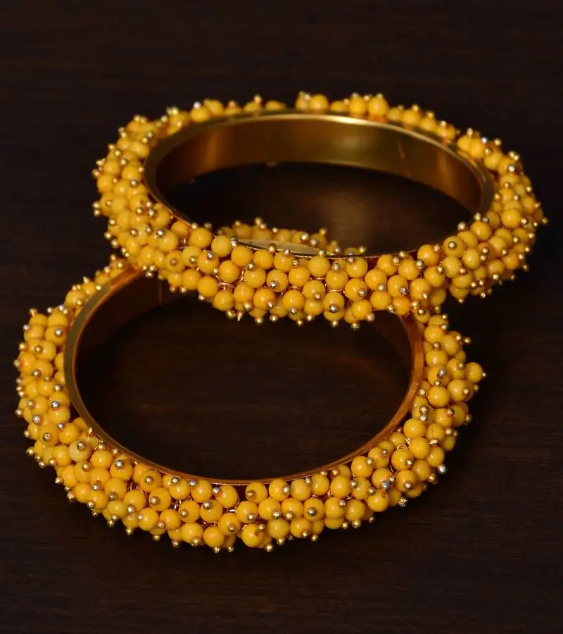 Yellow beaded gold plated pair of bangles for women