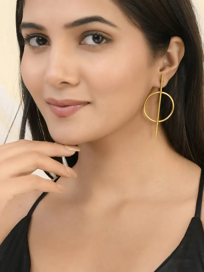 Beautiful gold tone long earrings
