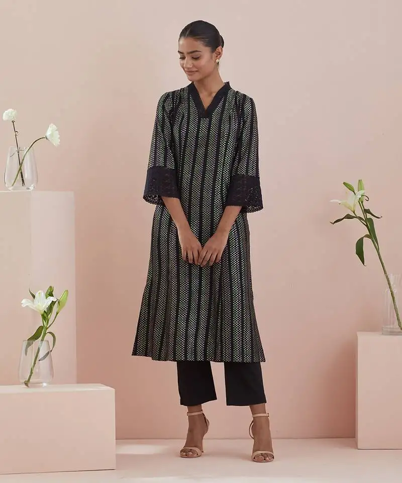 A line kurta in textured cotton with solid black pants