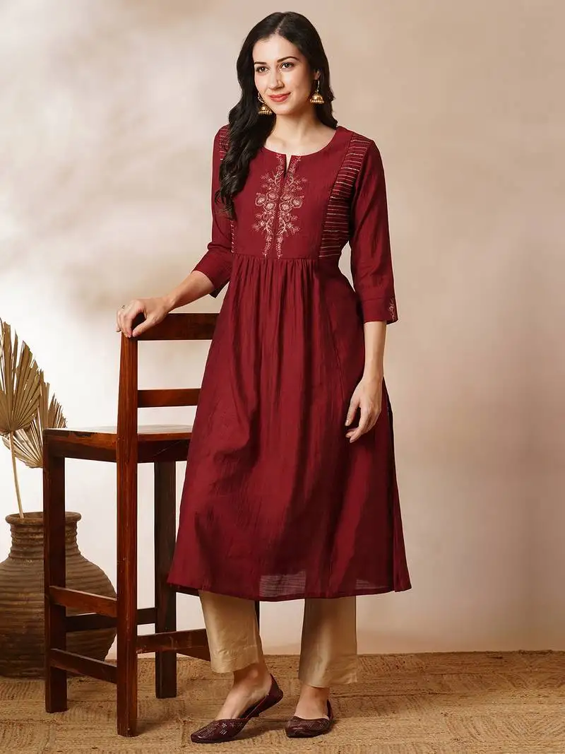 A-line gathered silk blend kurta with zari embroidery and a side pocket.