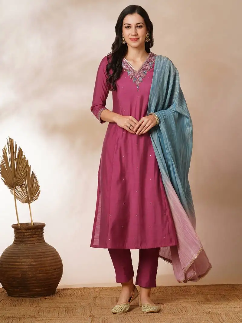 A-line kurta in silk blend fabric with embroidery detailing paired with lined silk blend pants and dupatta.