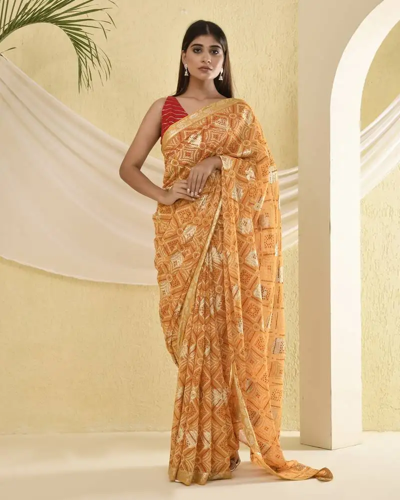 Yellow bandhani and zari work saree with unstitched blouse fabric