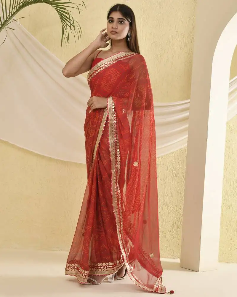 Red bandhani worked saree with unstitched blouse fabric