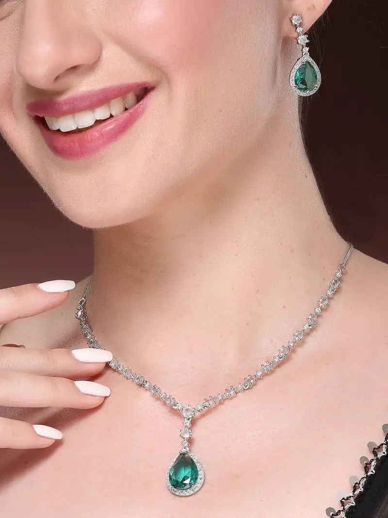 Women's silver-plated green american diamond-studded handcrafted jewellery set