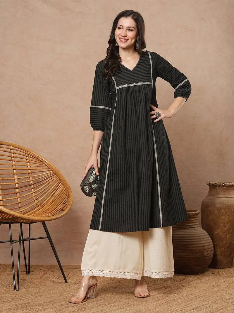 A-line shoulder princess kurta with under-bust gathers with contrast fabric trims and handwork.
