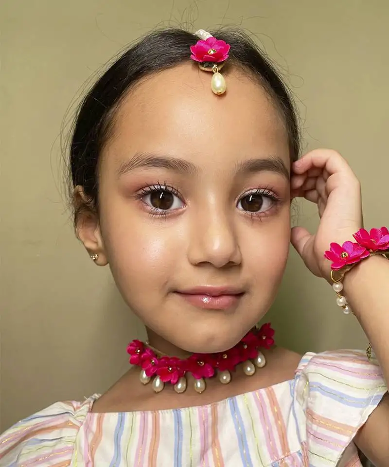 Noor floral set of necklace, 2 bracelets & mang teeka in a dark pink colour