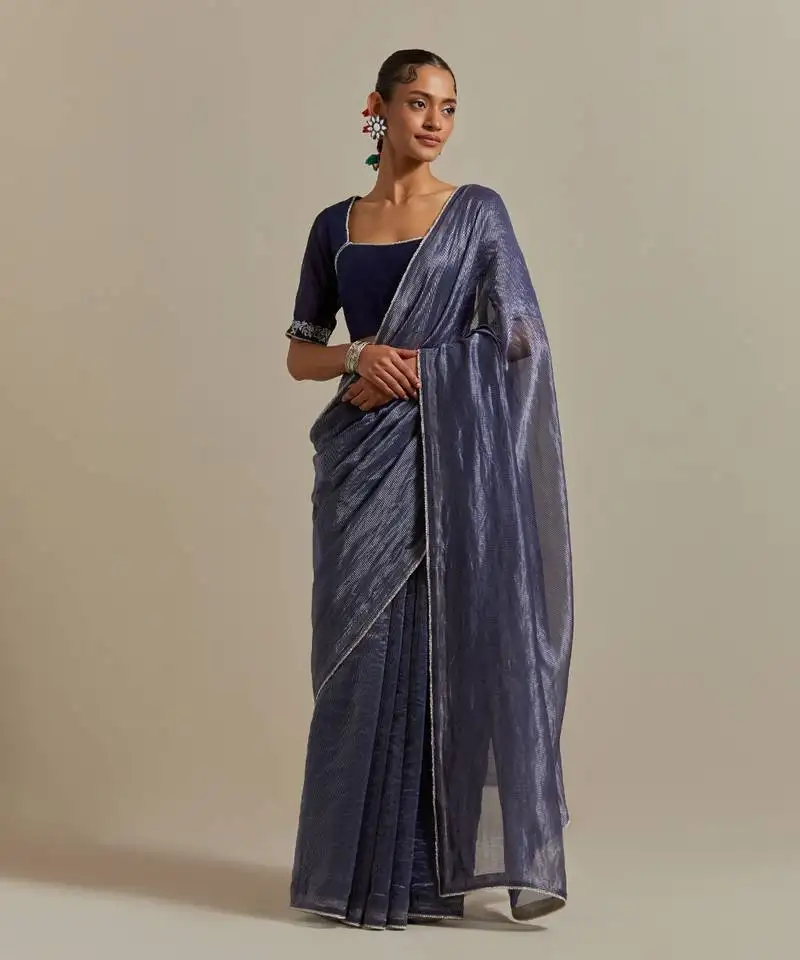 A blue chanderi striped saree with pearl lace detailing
