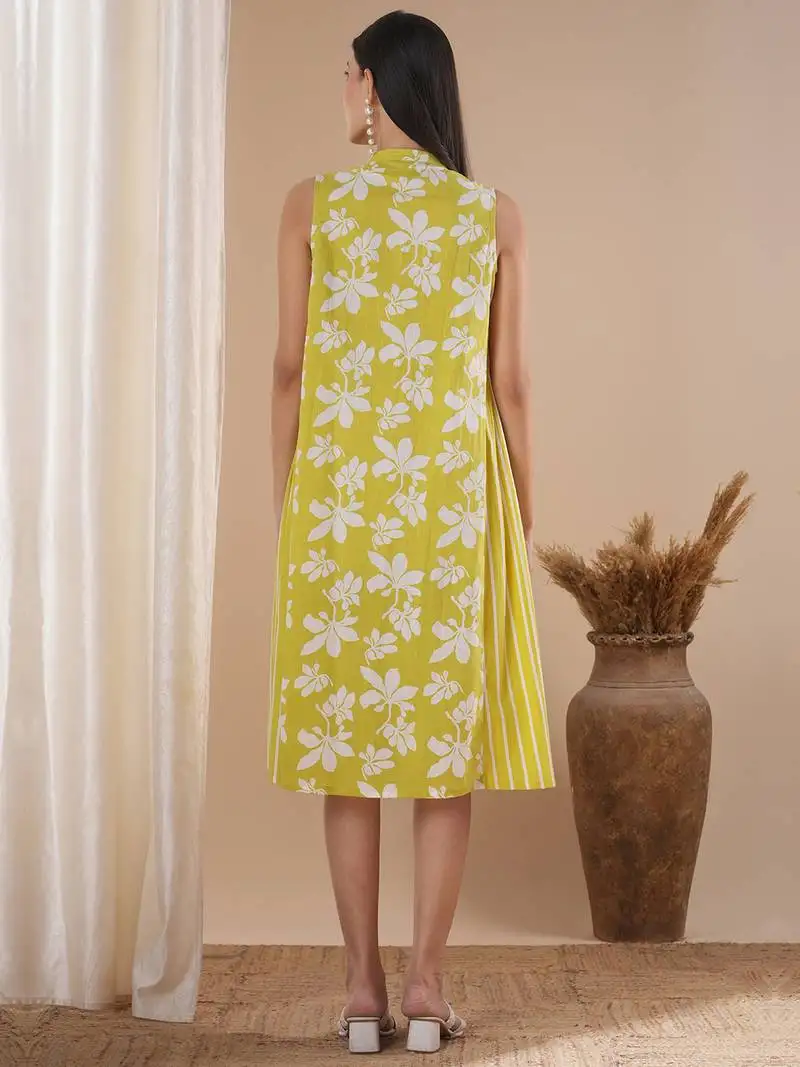 A printed dress with centre placket and pleated side panels with 2 pockets.