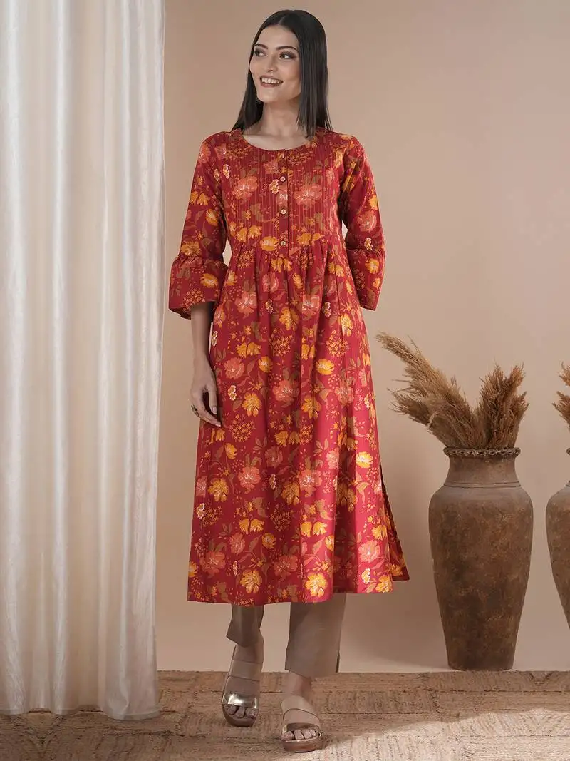 A printed shoulder princess a-line kurta with stitch lines on the shaped yoke and bell sleeves.